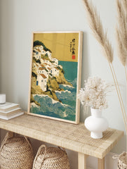 Japanese Coastal Wall Art print featuring a village of white houses on a green cliff overlooking a teal sea with white stylized waves. - Image 3