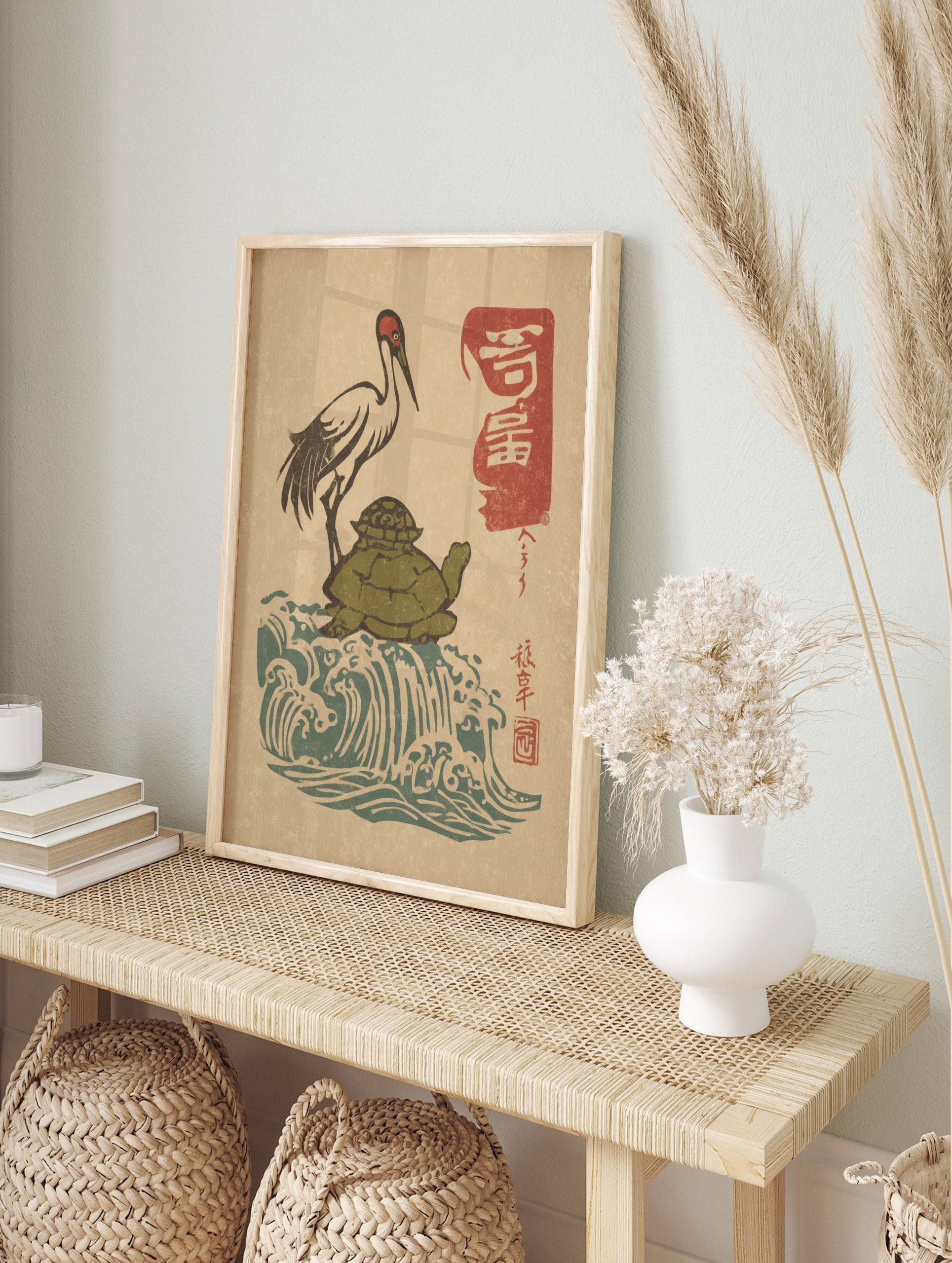 Japanese Ukiyo-e style print of a red-crowned crane on a green turtle, with blue waves and, in an alternate framed mockup