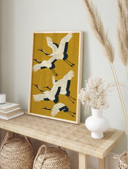 Japanese crane art poster with four elegant white and black flying cranes against a mustard yellow background. - Image 4
