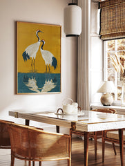 Japanese Crane poster featuring two white cranes with red heads standing in blue water against a gold background. - Image 2