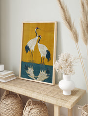 Japanese Crane poster featuring two white cranes with red heads standing in blue water against a gold background. - Image 4