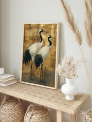 Illustrative Japanese crane wall art featuring two white and black cranes with red crowns on, in an alternate framed mockup