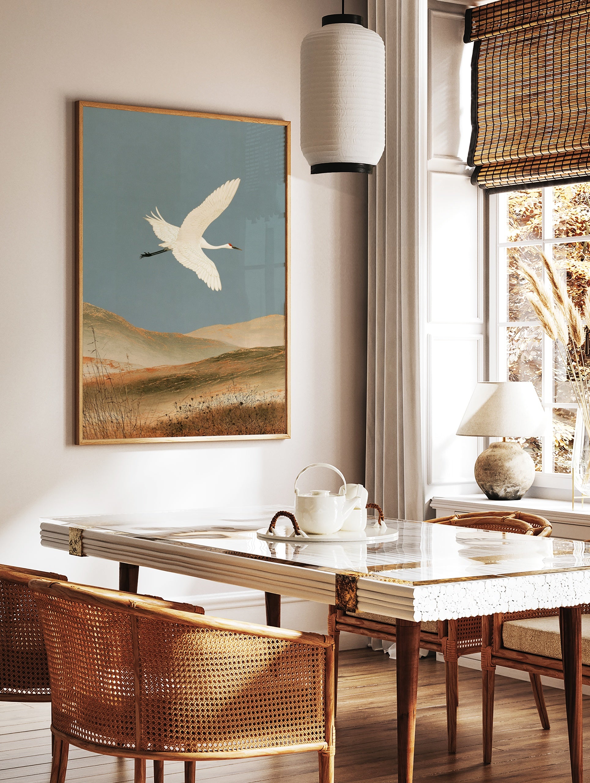 White crane in flight over earthy hills, Japanese-inspired nature wall art print, in a styled room mockup