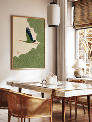 Japanese crane wall art showing a green and blue bird flying over swirling green clouds on a cream background. - Image 3