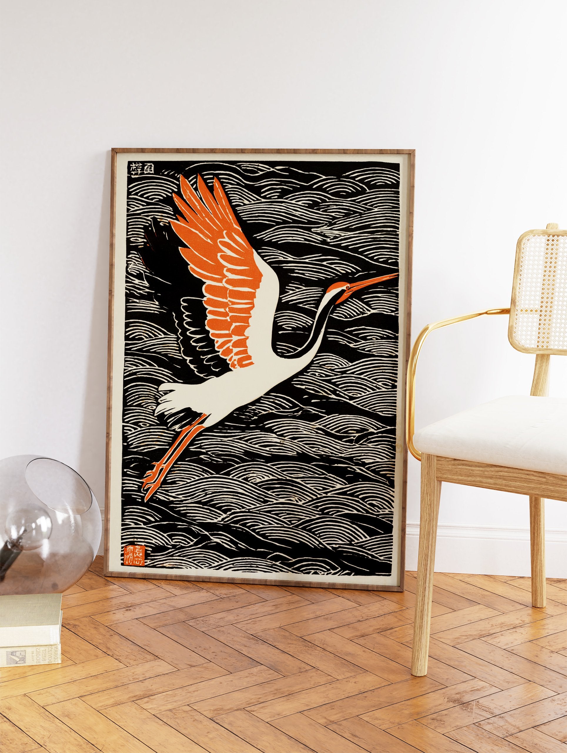Japanese Crane Wall Art, a woodblock print of a white crane with orange wings flying over black and white ocean waves. - Image 2