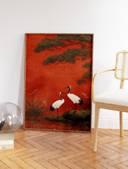 Japanese crane wall art print with two red-crowned cranes, pine trees, and water on a vibrant red background. - Image 2