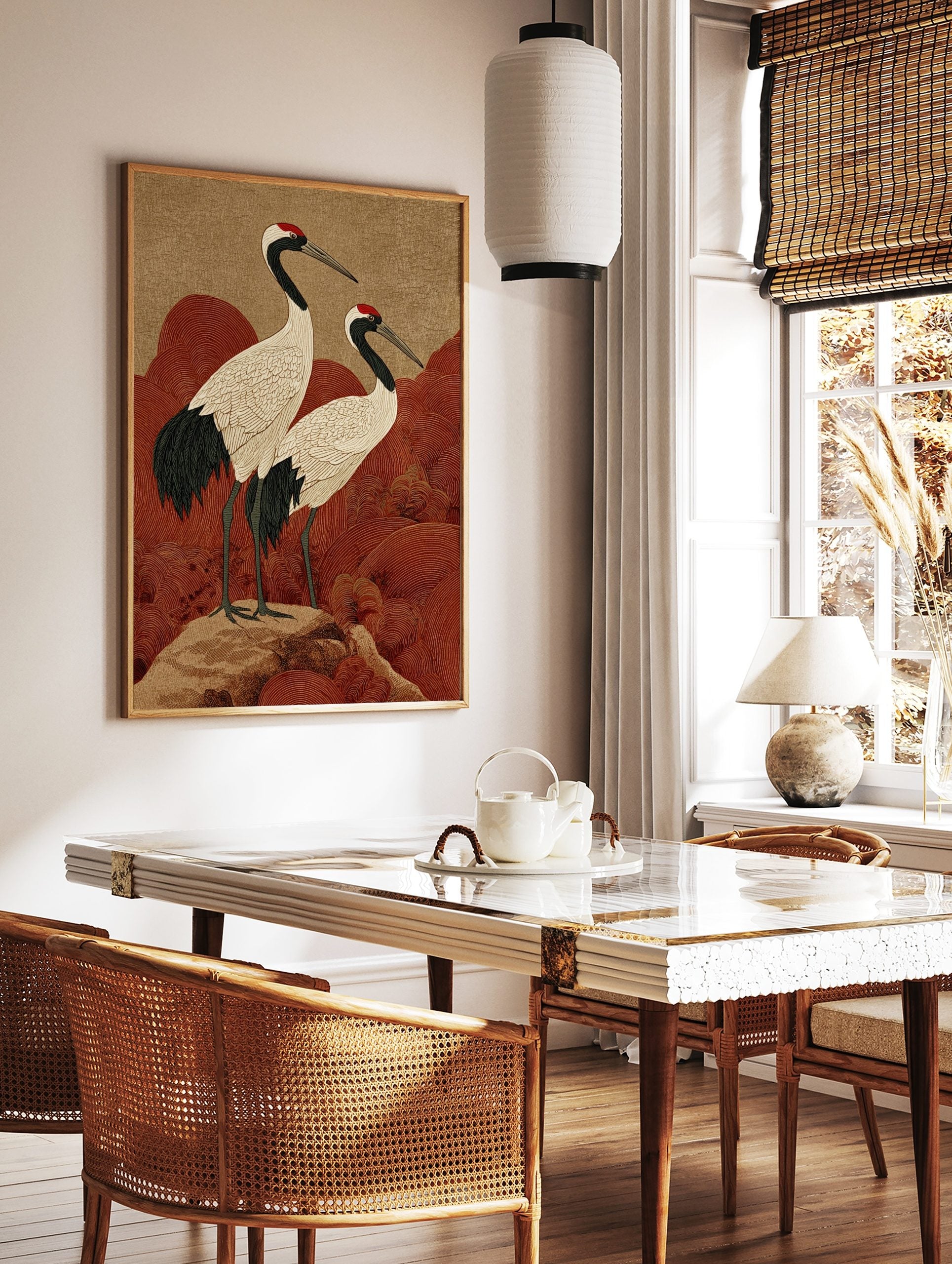 Japanese crane wall art with two red-crowned cranes on a rock, with red wave patterns and a, in a styled room mockup