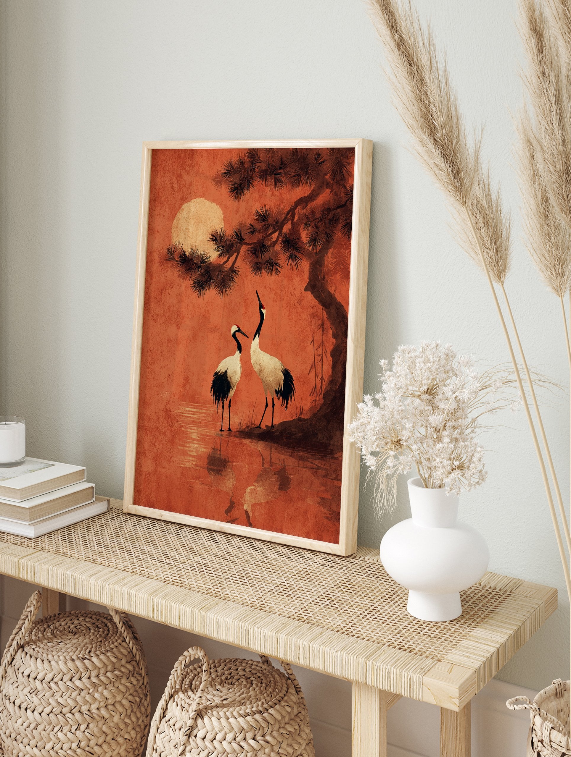 Japanese crane wall art featuring two cranes by water under a pine tree and a large red moon in an orange sky. - Image 3