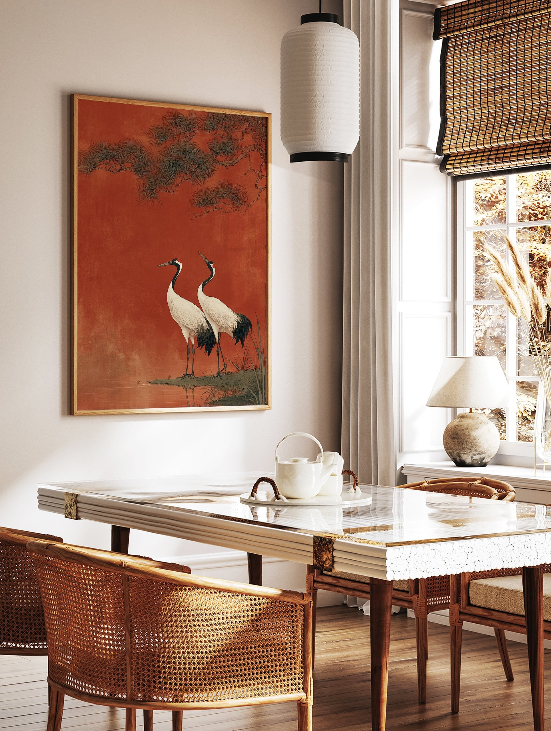 Two Japanese cranes with white bodies and black necks standing by water under pine branches against a textured red background. - Image 3