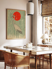Illustrative Japanese crane standing against a red sun and vertical green lines on a beige, in a styled room mockup