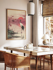 Japanese Red-crowned Crane Wall Art in water at sunset with a red sun, reeds, and rocks in a traditional watercolor style. - Image 2