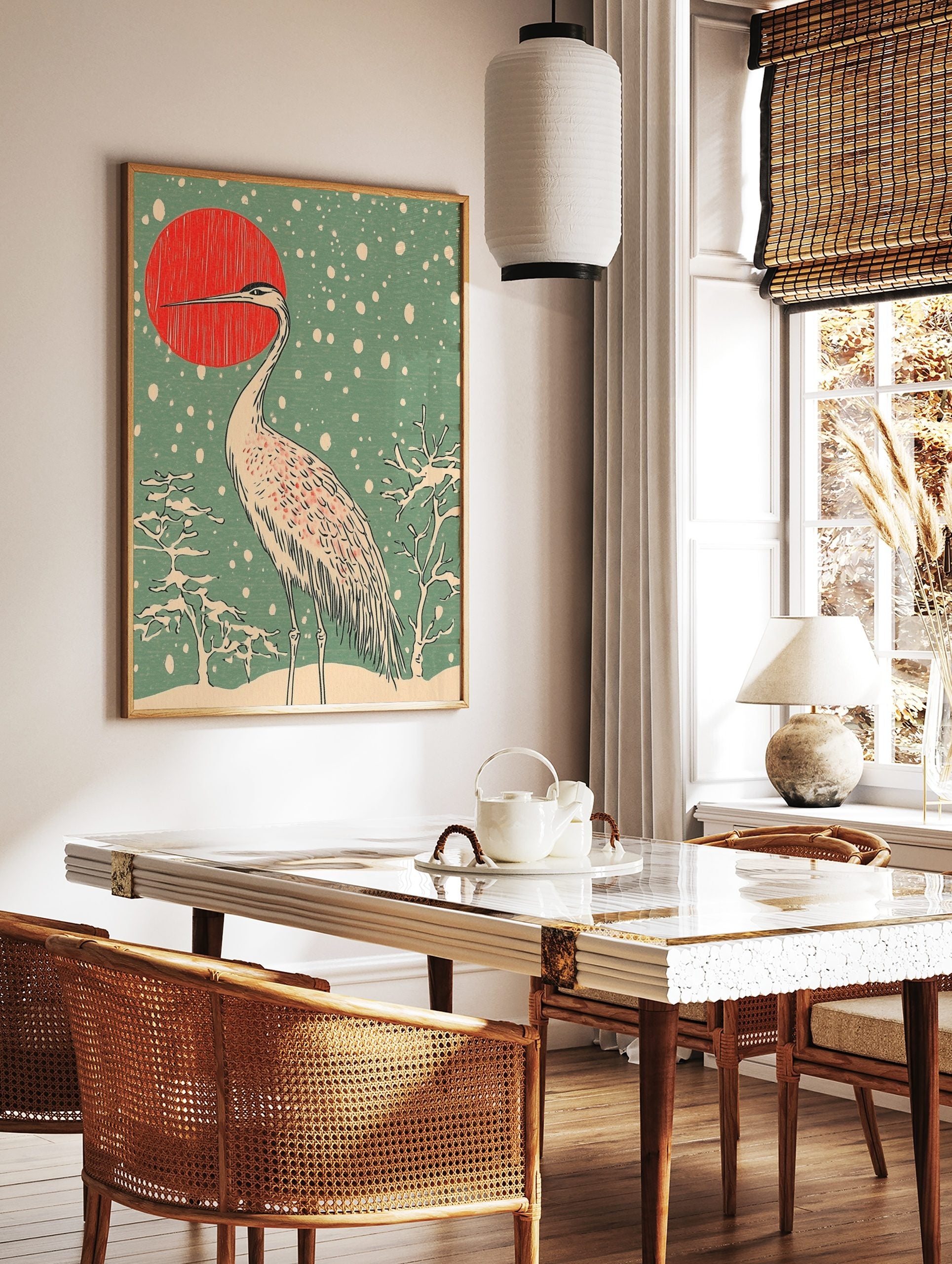 Japanese crane standing in snow with red sun and snowflakes in woodblock print art style, in a styled room mockup