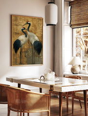 Two elegant Japanese Red-crowned Cranes with dark blue and white plumage on a textured golden, in a styled room mockup