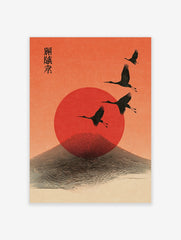 Four black cranes flying across a red sun and stylised mountain against an orange sky, with Japanese text