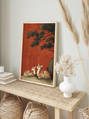 Japanese deer wall art print showing two spotted deer resting under a dark pine tree against a vibrant red background. - Image 3