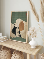 A Japanese Dog Art Print featuring two white and black/brown sleeping dogs cuddled together on a teal background with red seals. - Image 3