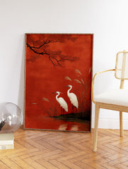 Japanese egret wall art print showing two white birds by water with red leaves and tall reeds against a rich red background. - Image 2