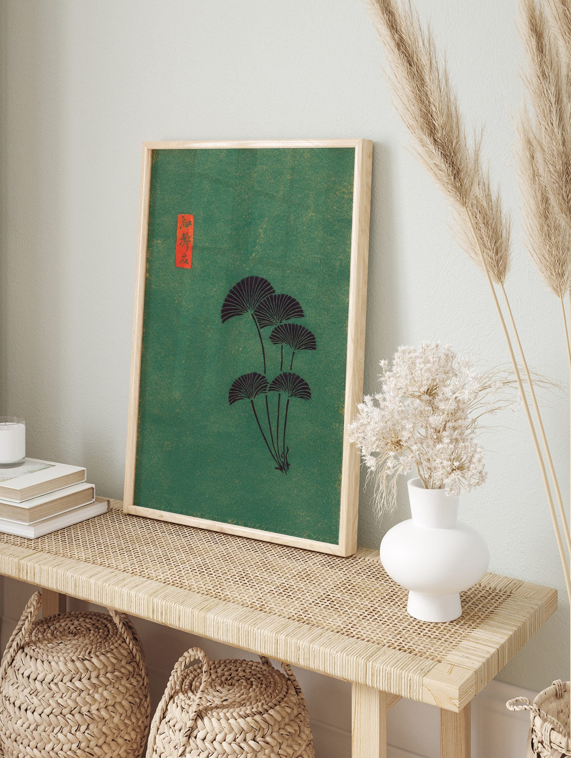 Japanese fan leaves botanical art print with dark foliage on a textured green background and, in an alternate framed mockup