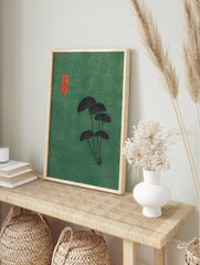 Japanese fan leaves botanical art print with dark foliage on a textured green background and, in an alternate framed mockup