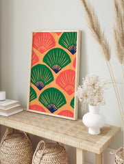 Repeating pattern of green and coral Japanese fans with dark blue accents on an orange, in an alternate framed mockup