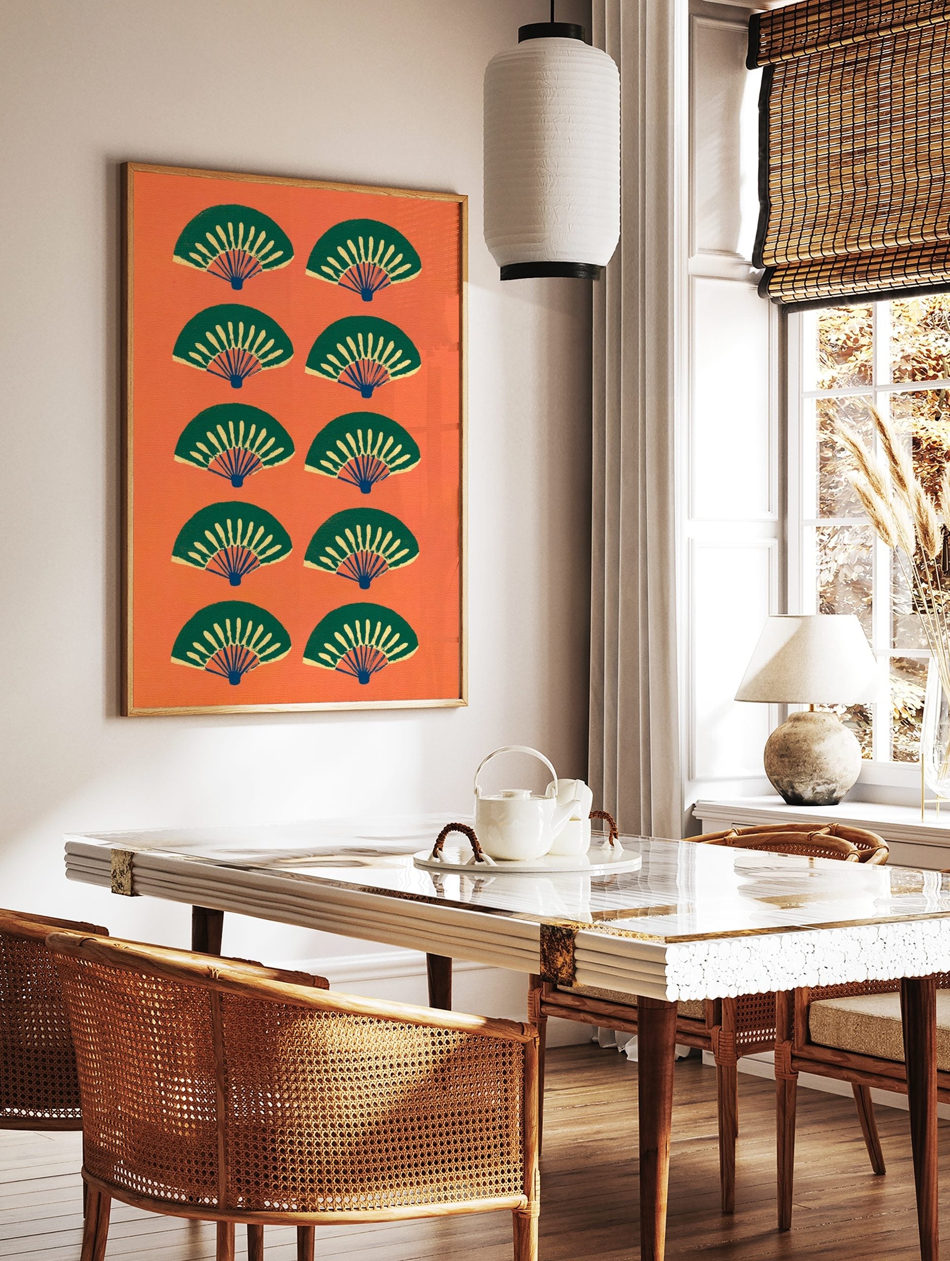 Pattern of stylised green and yellow Japanese fans on a vibrant orange background, in a styled room mockup