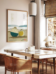 Japanese fishing floats print with blue and white, and yellow floats in nets on a textured beach by, in a styled room mockup