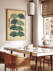 Japanese folding fans with wave patterns and calligraphy in green and beige, woodblock print style, in a styled room mockup