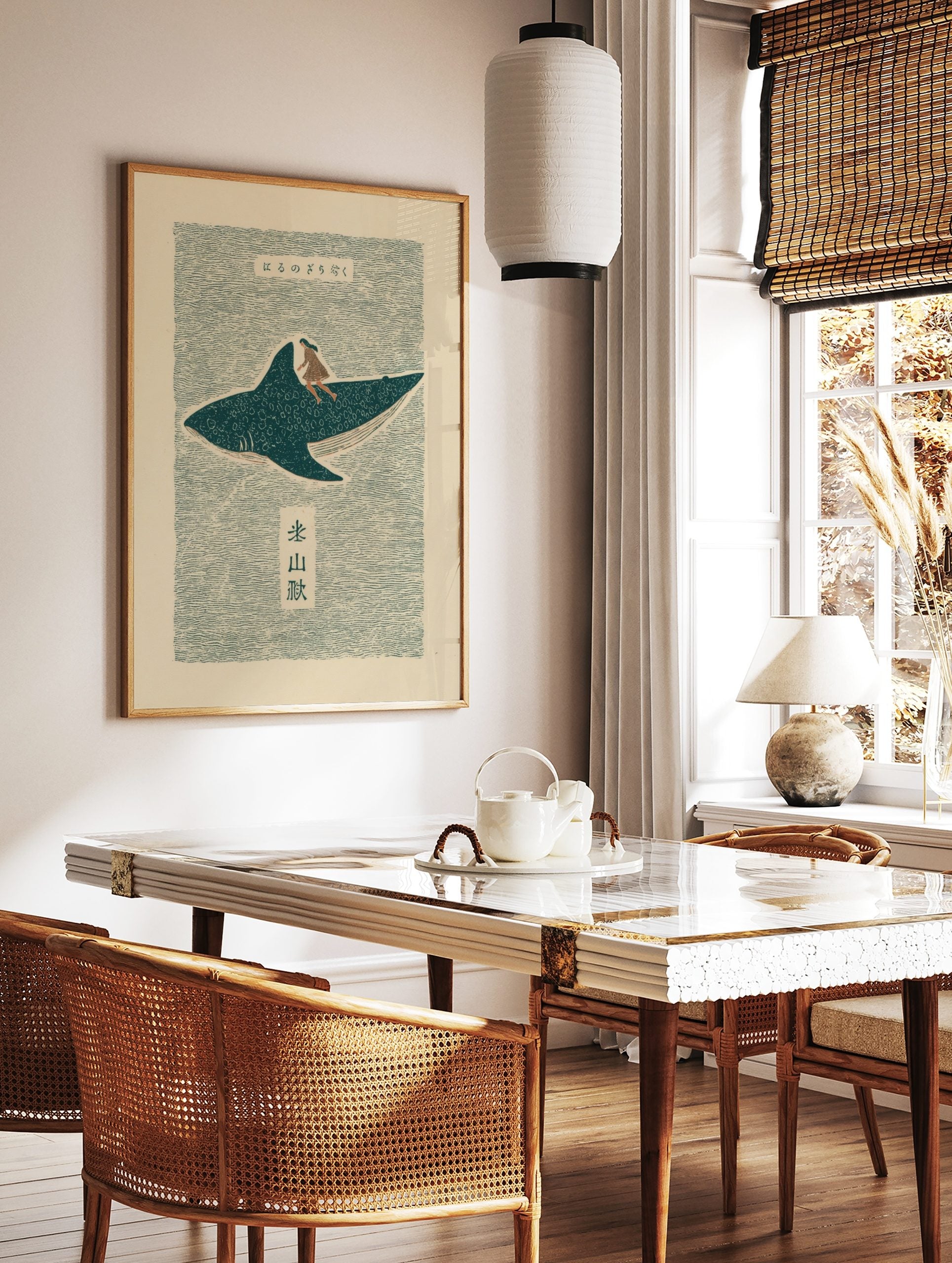 Japanese folk art print of a woman riding a spotted whale shark on wavy teal water with Kanji text, in a styled room mockup