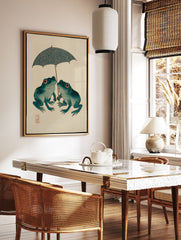 Japanese Frog Art print of two teal frogs with orange eyes sharing a patterned blue umbrella on a beige background. - Image 3