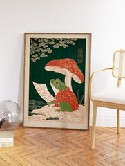 Japanese frog art print featuring a green frog in a red robe writing on a scroll under a mushroom with a green background. - Image 2