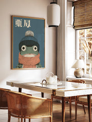 Japanese frog art print featuring a green frog wearing a blue knit hat with a pompom and an orange scarf on a blue background. - Image 2