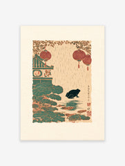 Japanese frog print showing a black frog in a rainy pond with red lanterns, green lotus leaves, and a traditional building.