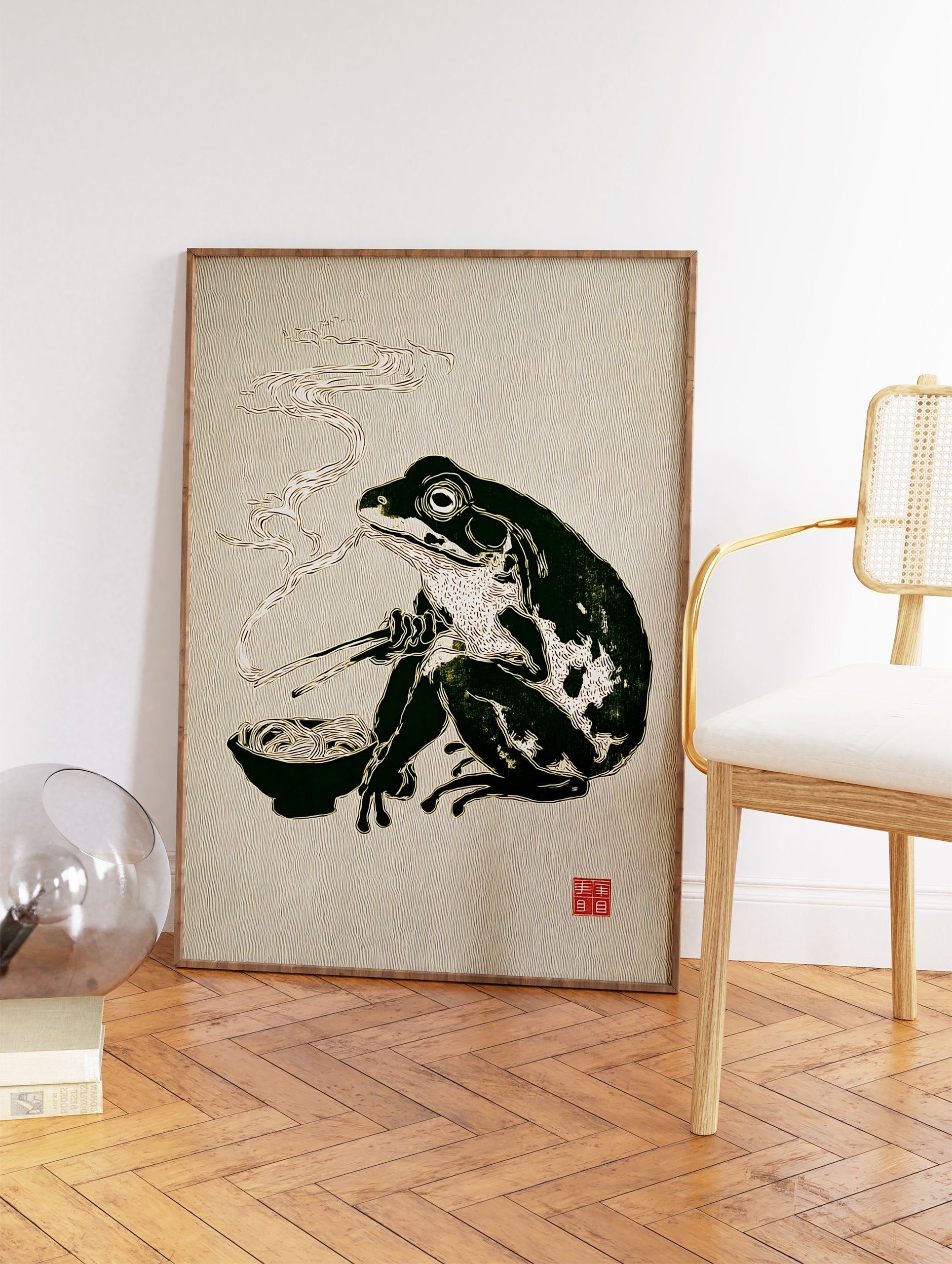 Illustrative Japanese frog art print of a dark green frog eating ramen noodles with chopsticks, with steam rising. - Image 2