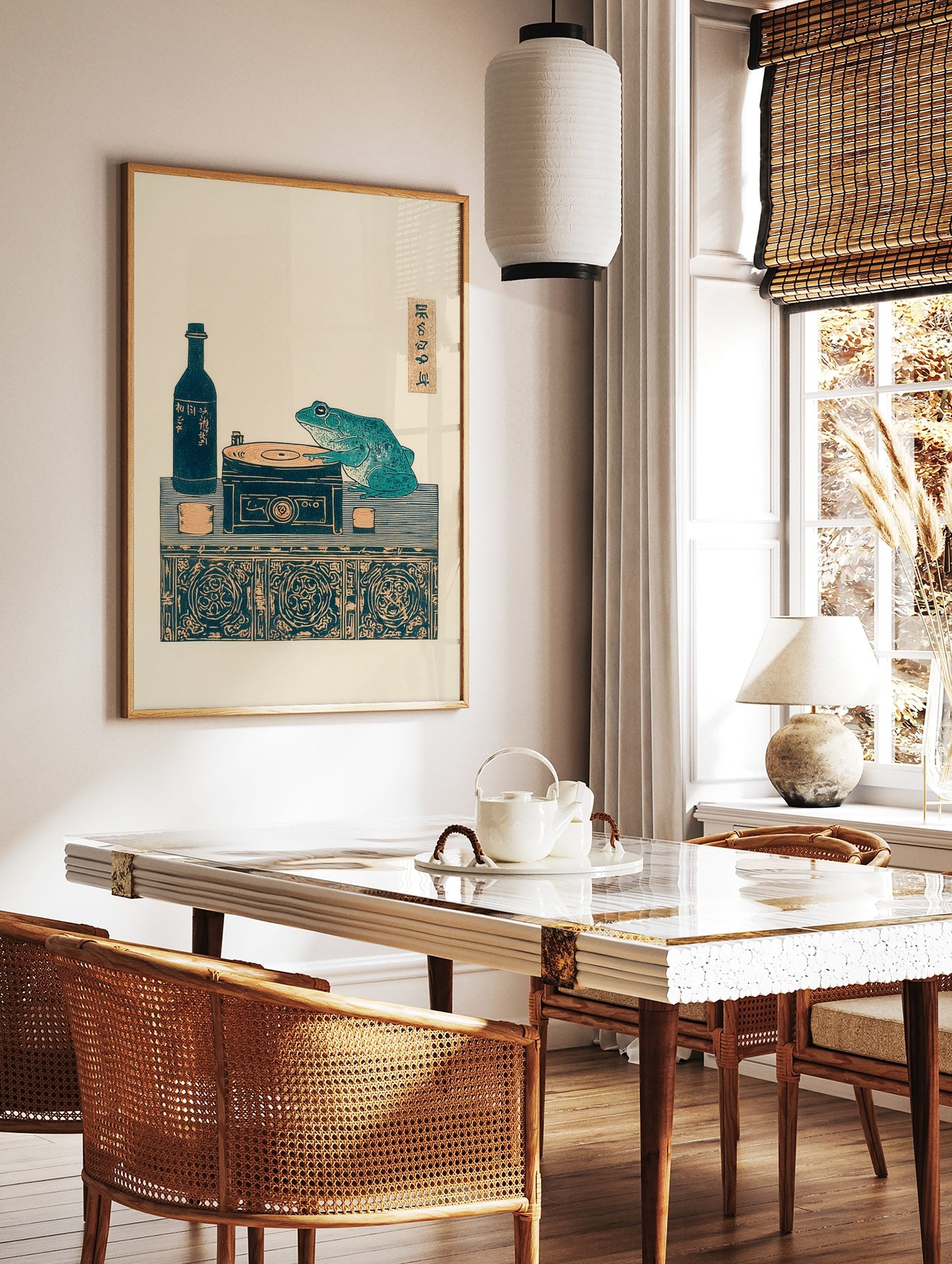 Japanese Ukiyo-e style print of a teal frog on a record player with a sake bottle and cups on a, in a styled room mockup
