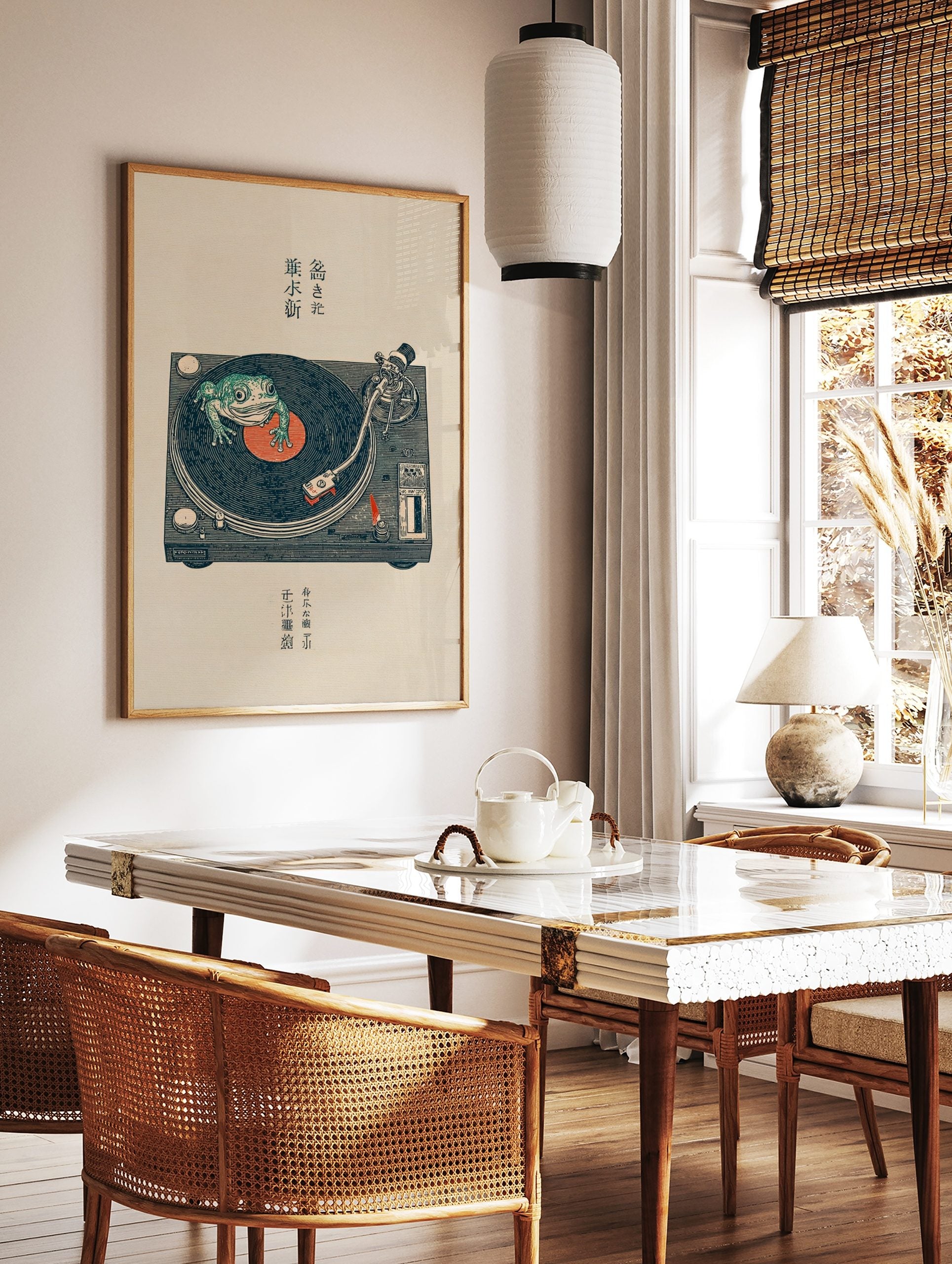Japanese illustrative print of a green frog on a turntable with a vinyl record, featuring kanji text, in a styled room mockup