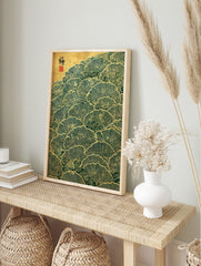 Stylised Japanese ginkgo leaves in green and gold, overlapping in a pattern with cloud motifs, in an alternate framed mockup