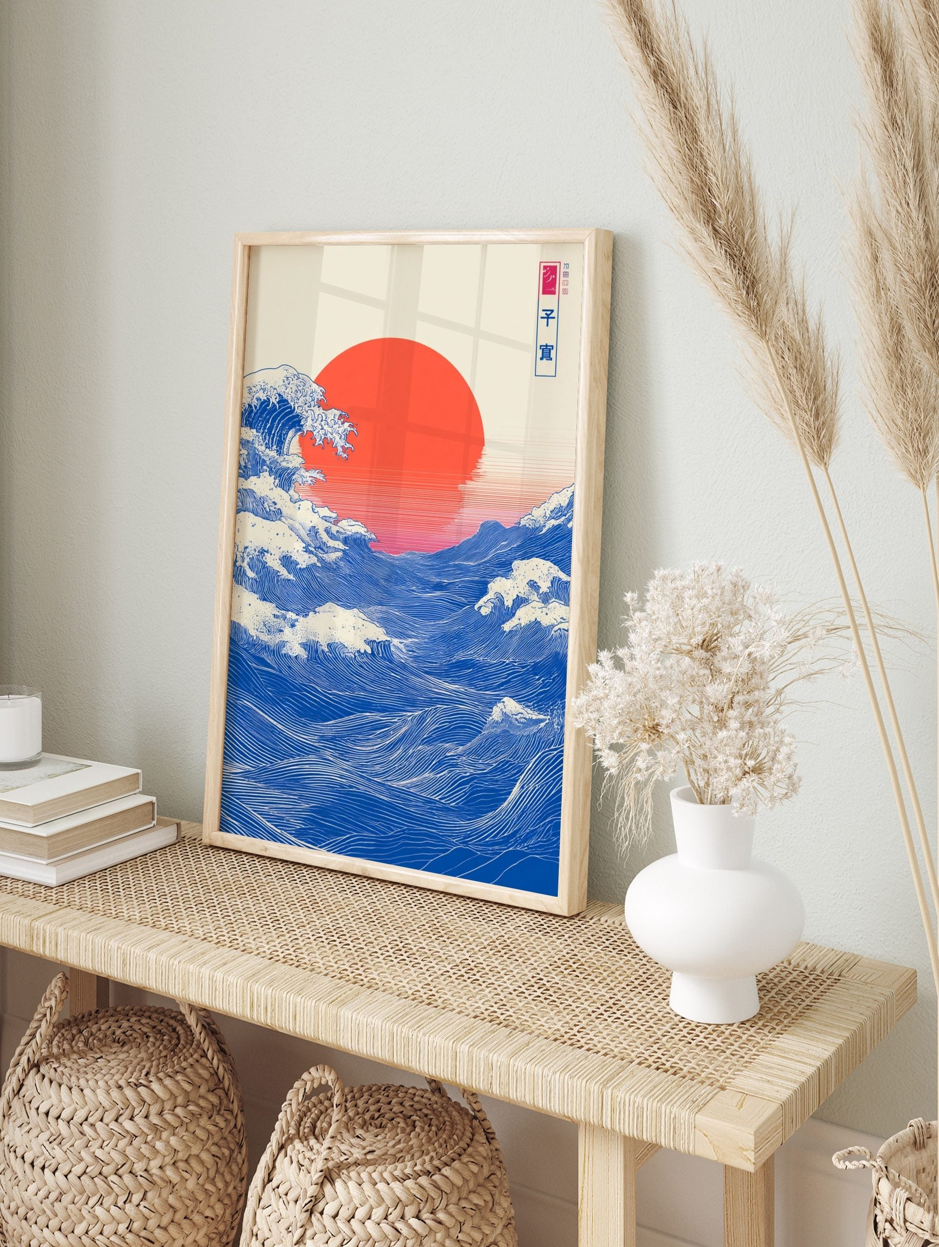 Japanese Great Wave art print with blue ocean waves, white foam, and a large red sun, in an alternate framed mockup