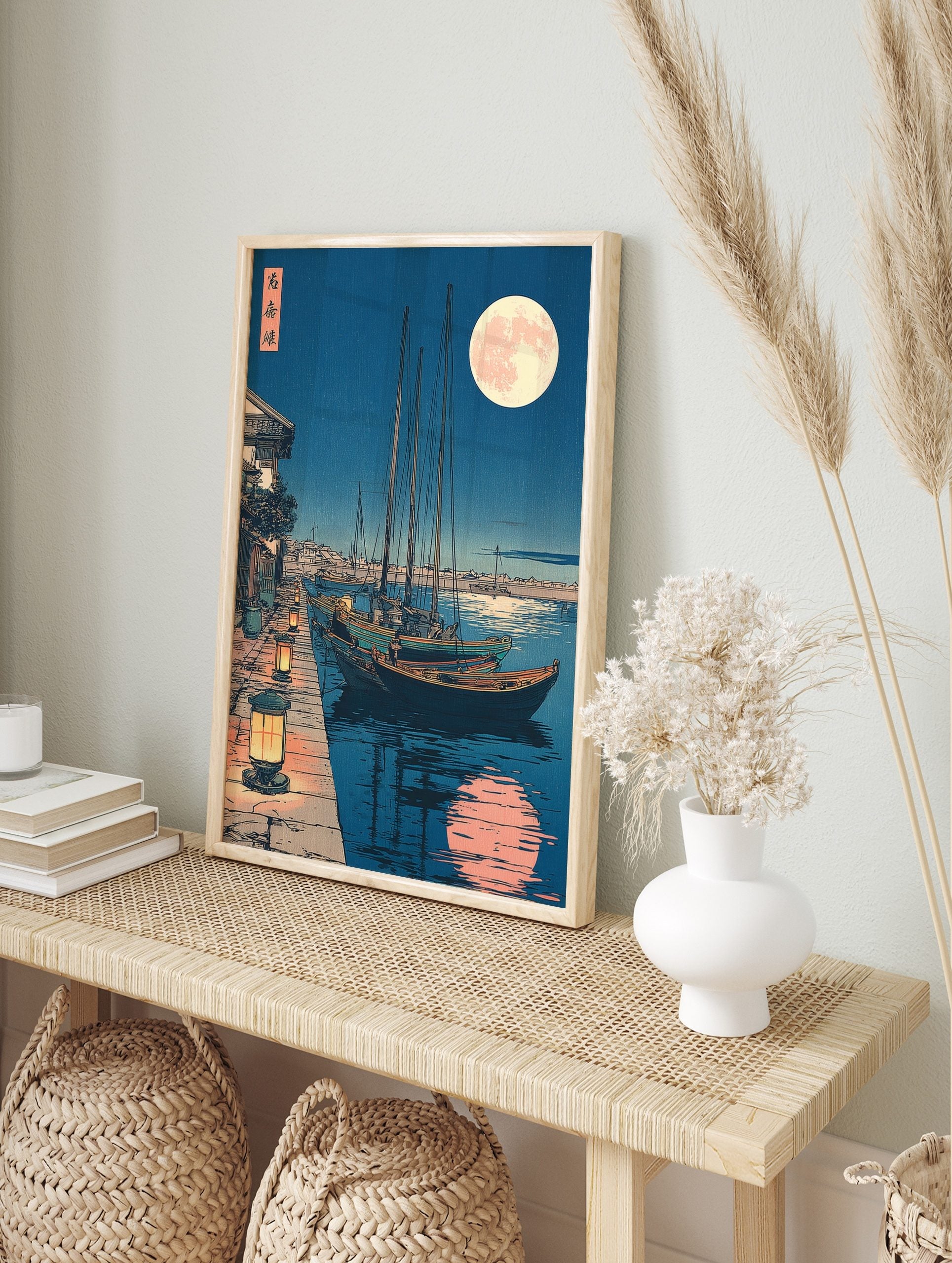 Japanese harbour night scene with boats, lanterns on quay, and large full moon with, in an alternate framed mockup