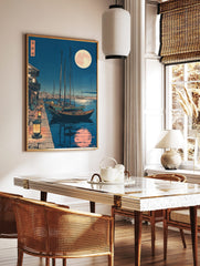 Japanese harbour night scene with boats, lanterns on quay, and large full moon with reflection in, in a styled room mockup