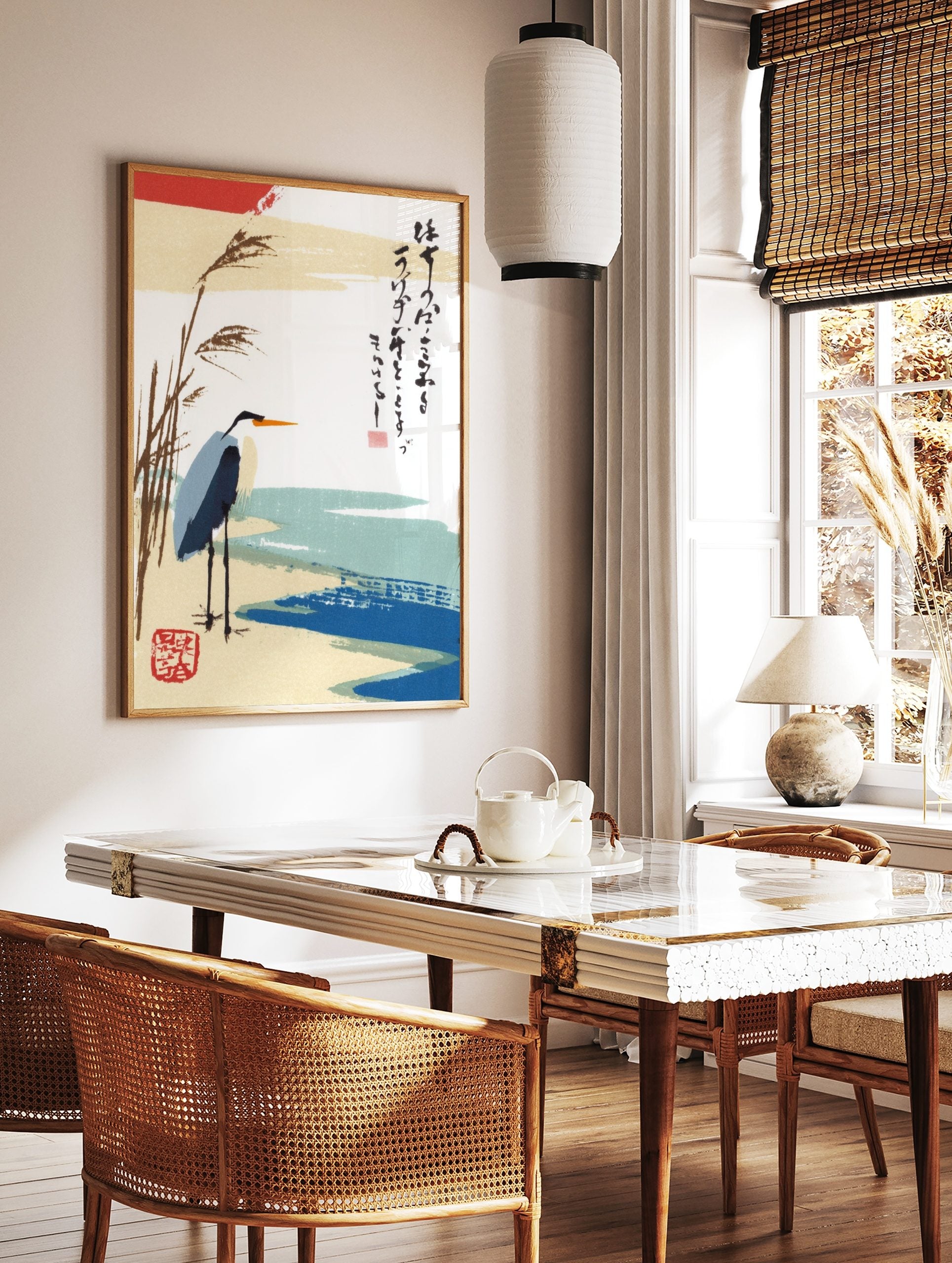 Japanese heron art print with reeds, blue water, and vertical calligraphy on a white background, in a styled room mockup