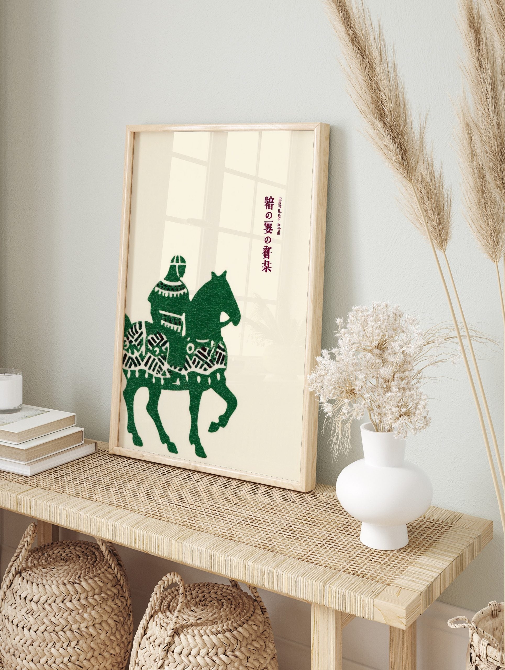 Green illustrative print of a Japanese horseback rider and horse with vertical Japanese text, in an alternate framed mockup