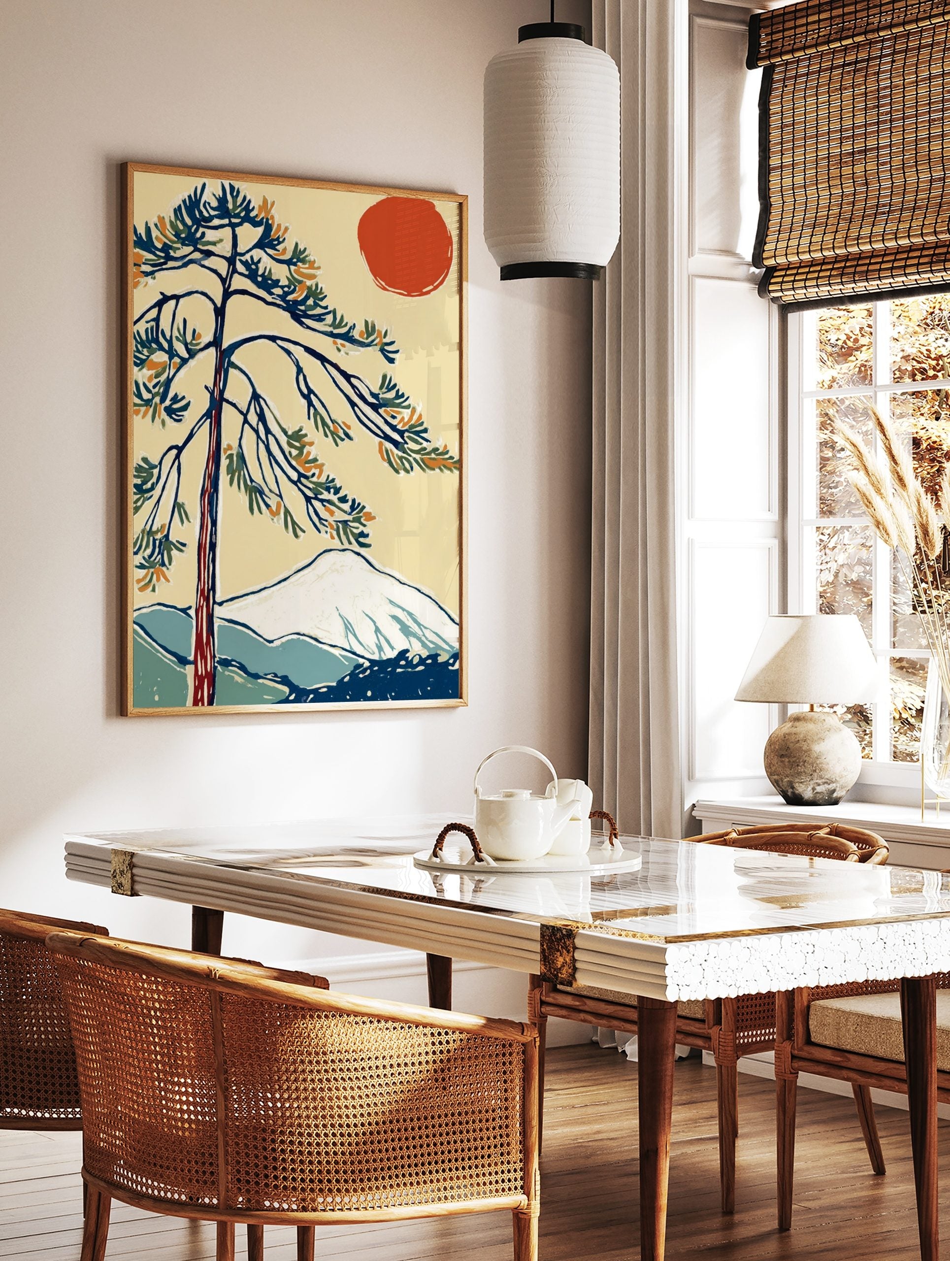 Stylised pine tree, red sun, and snow-capped mountain in Japanese-inspired art print, in a styled room mockup