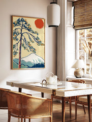 Stylised pine tree, red sun, and snow-capped mountain in Japanese-inspired art print, in a styled room mockup