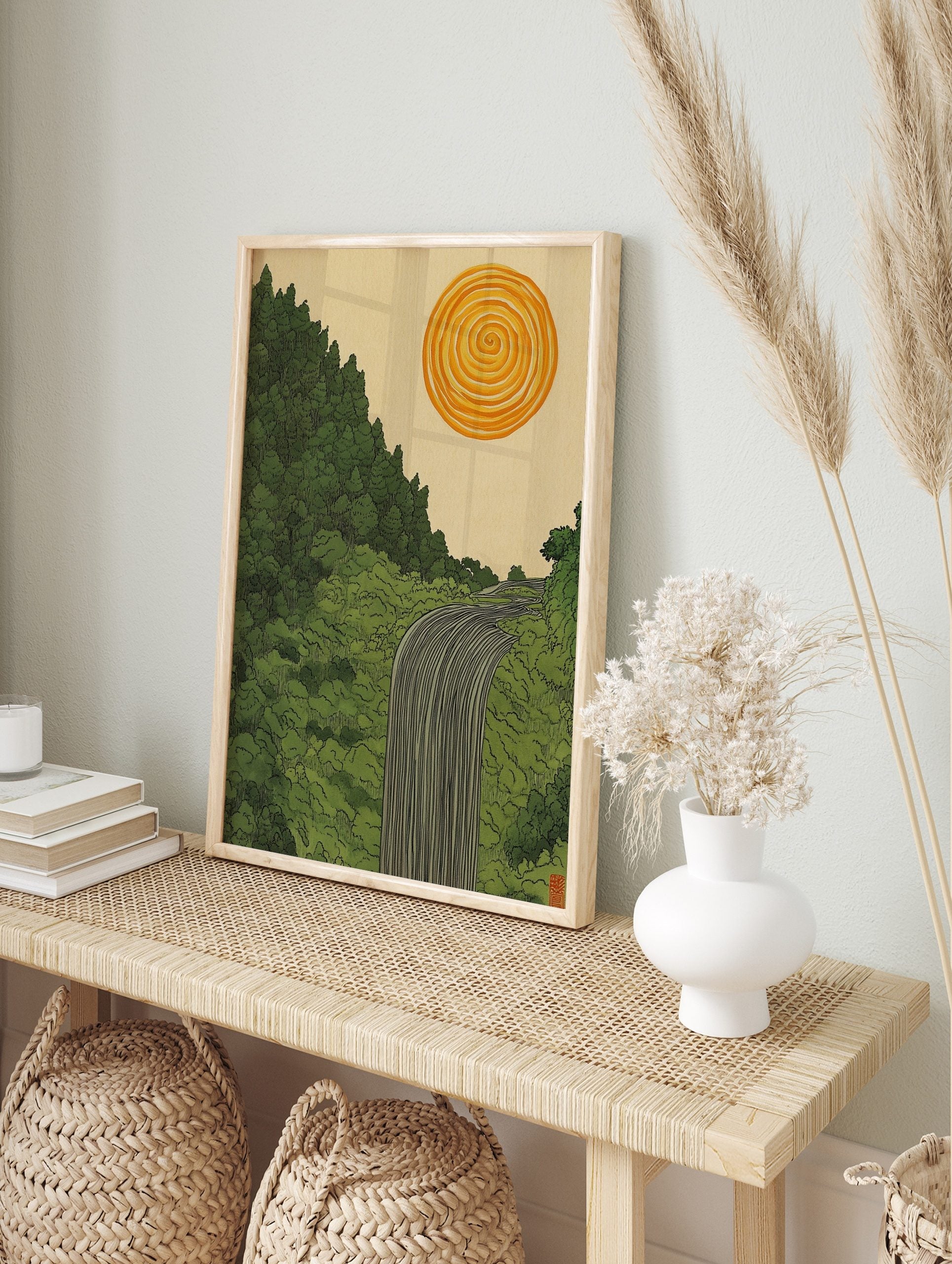 Illustrative waterfall flowing through a green forest with a spiral orange sun in a, in an alternate framed mockup