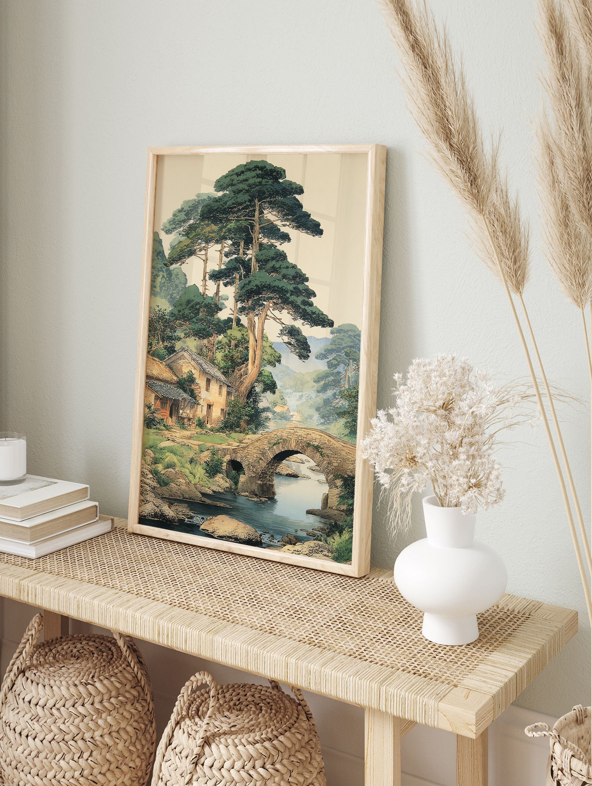 Traditional Japanese landscape art print showing a village with houses, pine trees, stone bridge over a river, and mountains. - Image 3