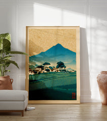 Traditional Japanese landscape woodblock print with a blue mountain, village, green fields, and golden patterned sky. - Image 3