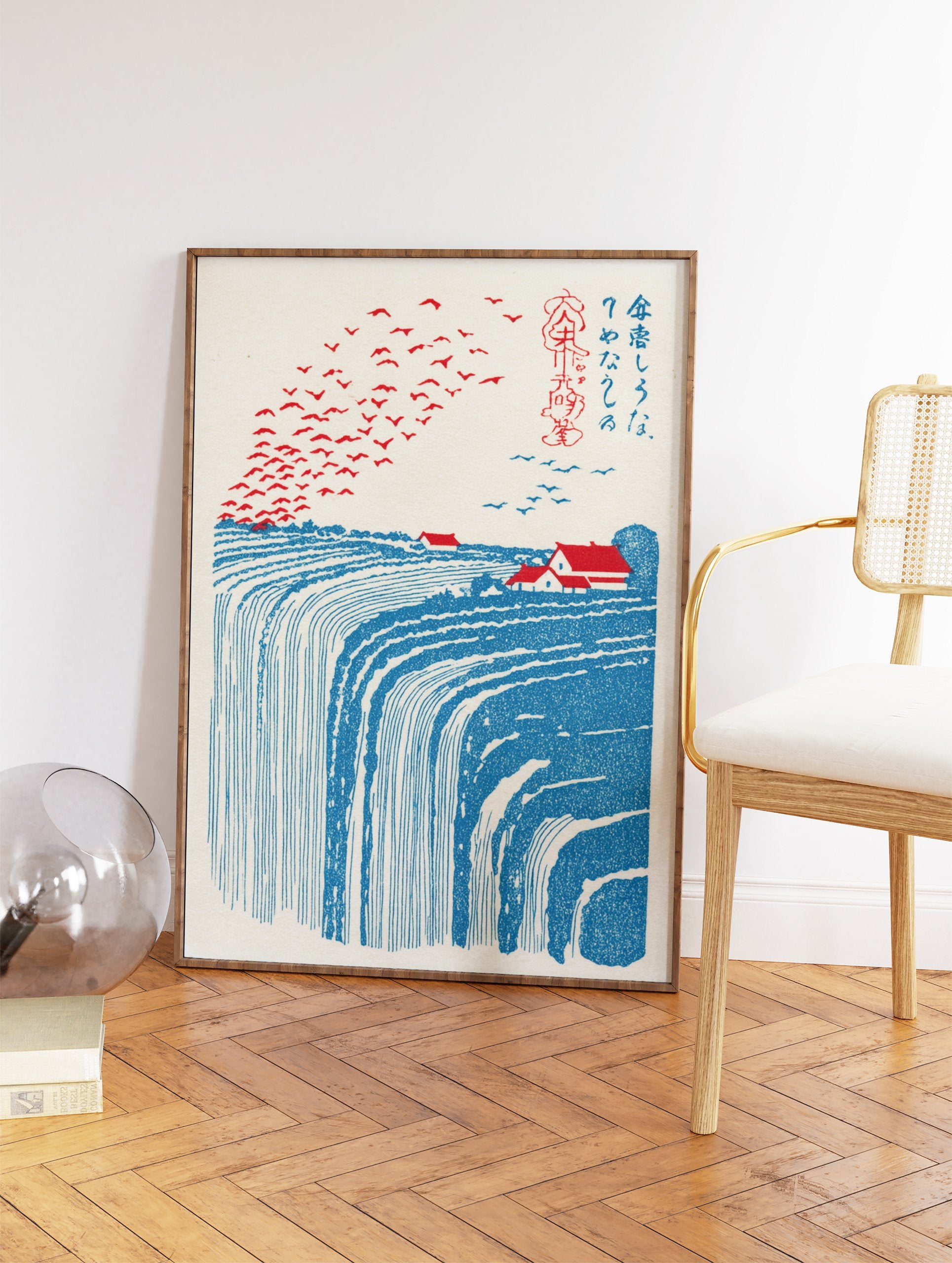 Japanese landscape illustration with a large blue waterfall, red-roofed houses, and many red birds flying in the sky. - Image 2