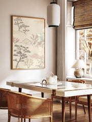 Japanese landscape art print with stylised pine trees, red blossom branches, mountains, and clouds, in a styled room mockup