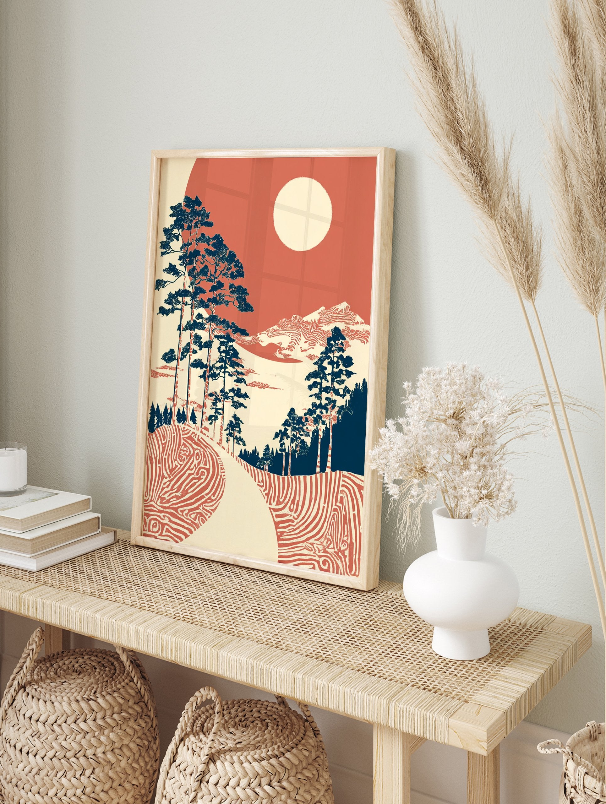 Japanese landscape wall art with blue pine trees, red patterned ground, distant mountains, and a cream sun in a red sky. - Image 3