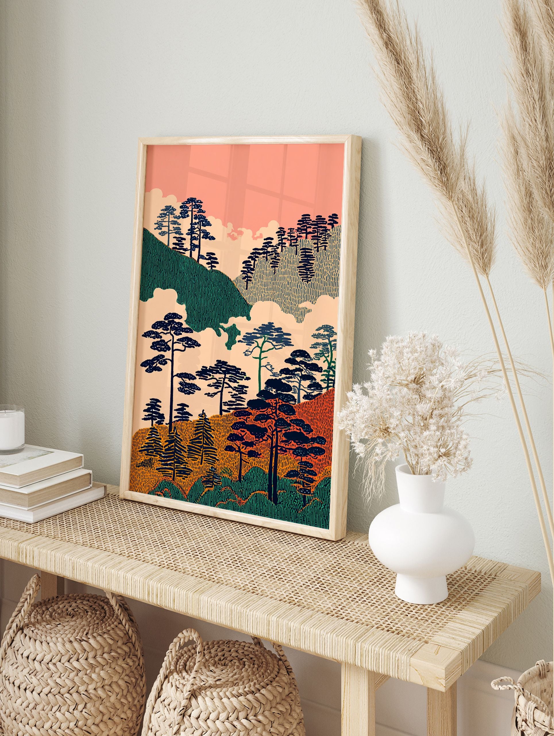 Stylized Japanese landscape wall art with dark pine trees on green and orange textured hills under a pink sky with clouds. - Image 3